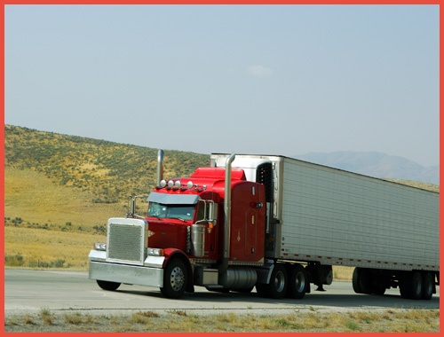 Red Truck Moving on a Highway