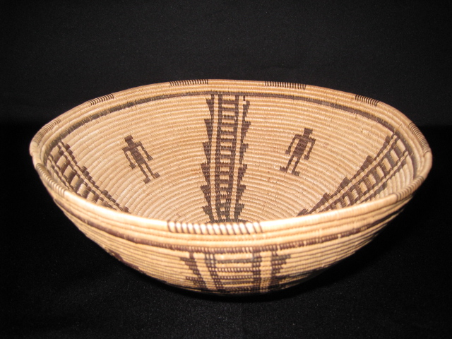 PRODUCT PROFILE :
Product No. : #70025
Description : Panamint Open Bowl
PRODUCT NARRATIVE :
• 4 human figures, stepping vertical pattern
• willow, devil's claw
• 3-rod foundation
• size H. 5" Diam. 9"