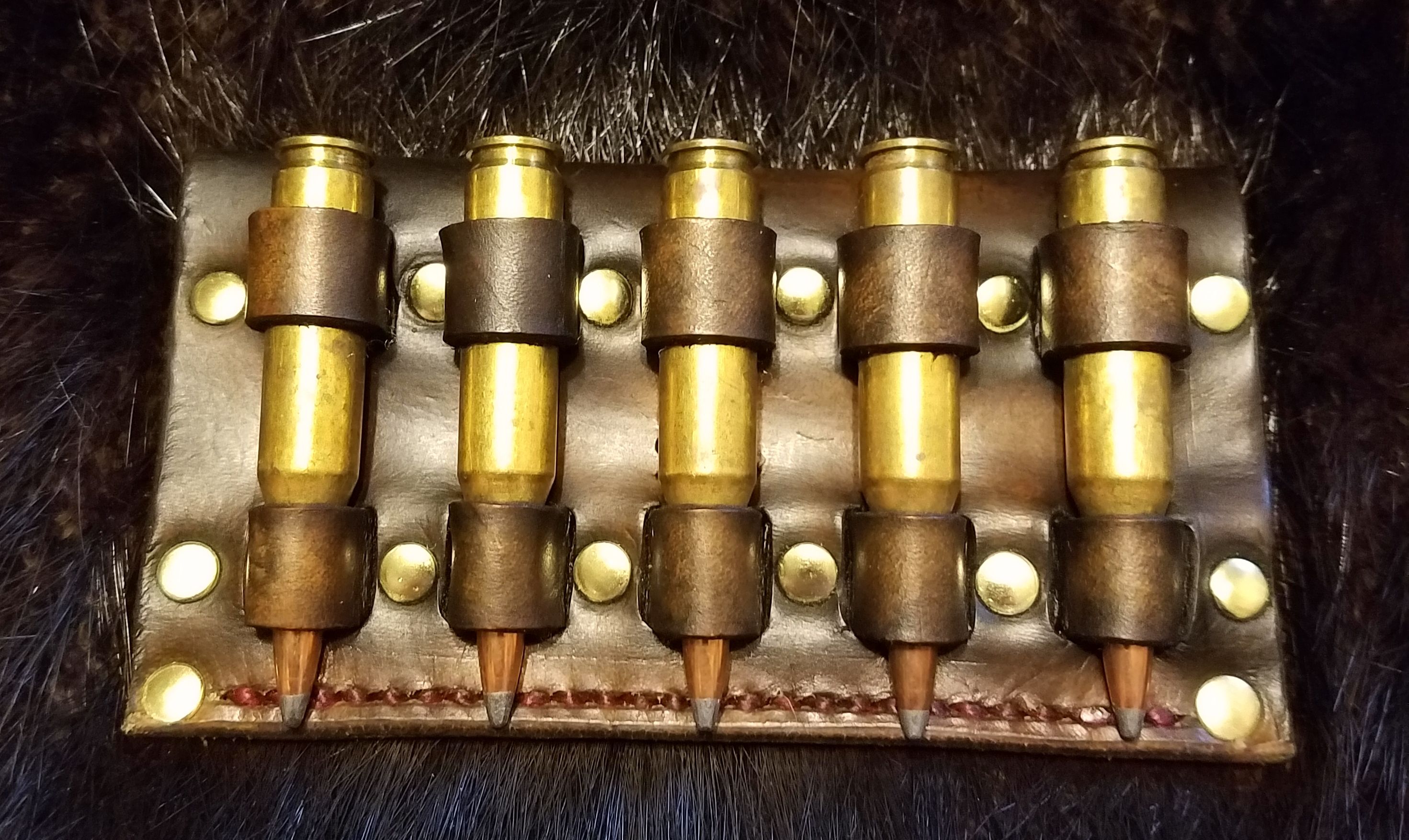 243 ammo holder, hand tooled and stitched,  $40.00