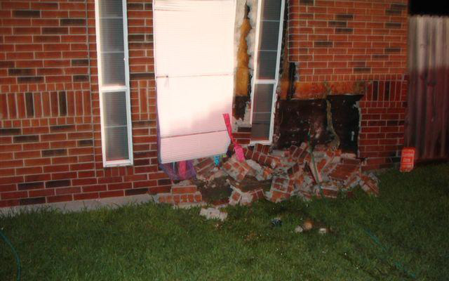 Damaged exterior of brick home