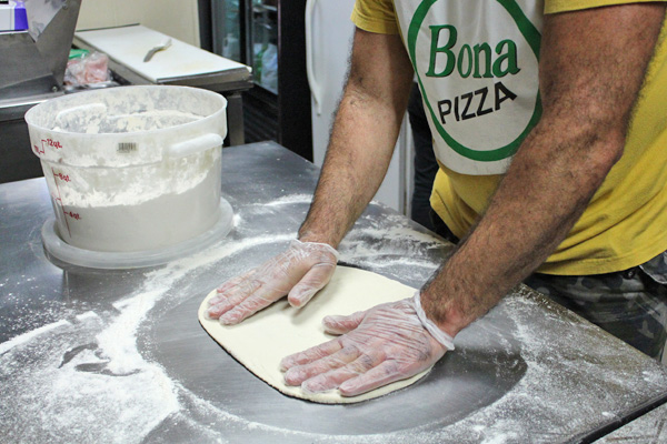 A Man Making Pizza