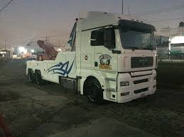 Woman in a dress next to a bike