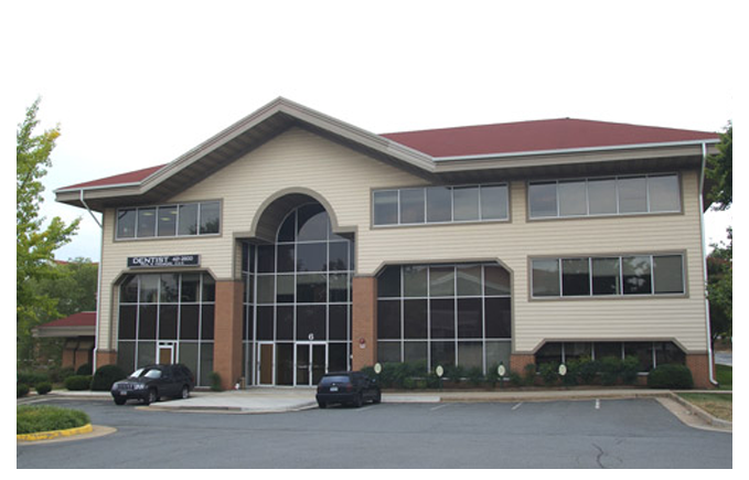 Agent Handing Over the Keys in Front of Business Office