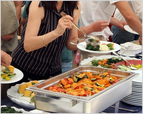 People Self Serving On a Buffet
