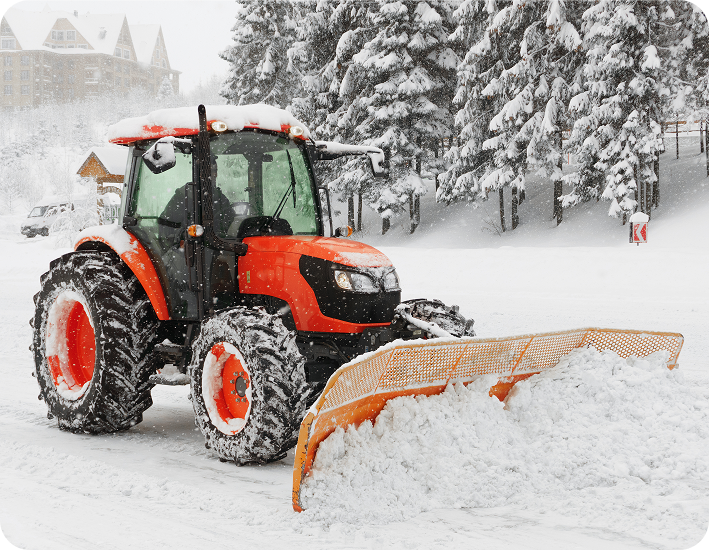 A snow plow clearing a road