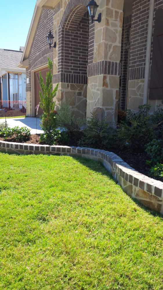 Stone and brick borders matching the facade