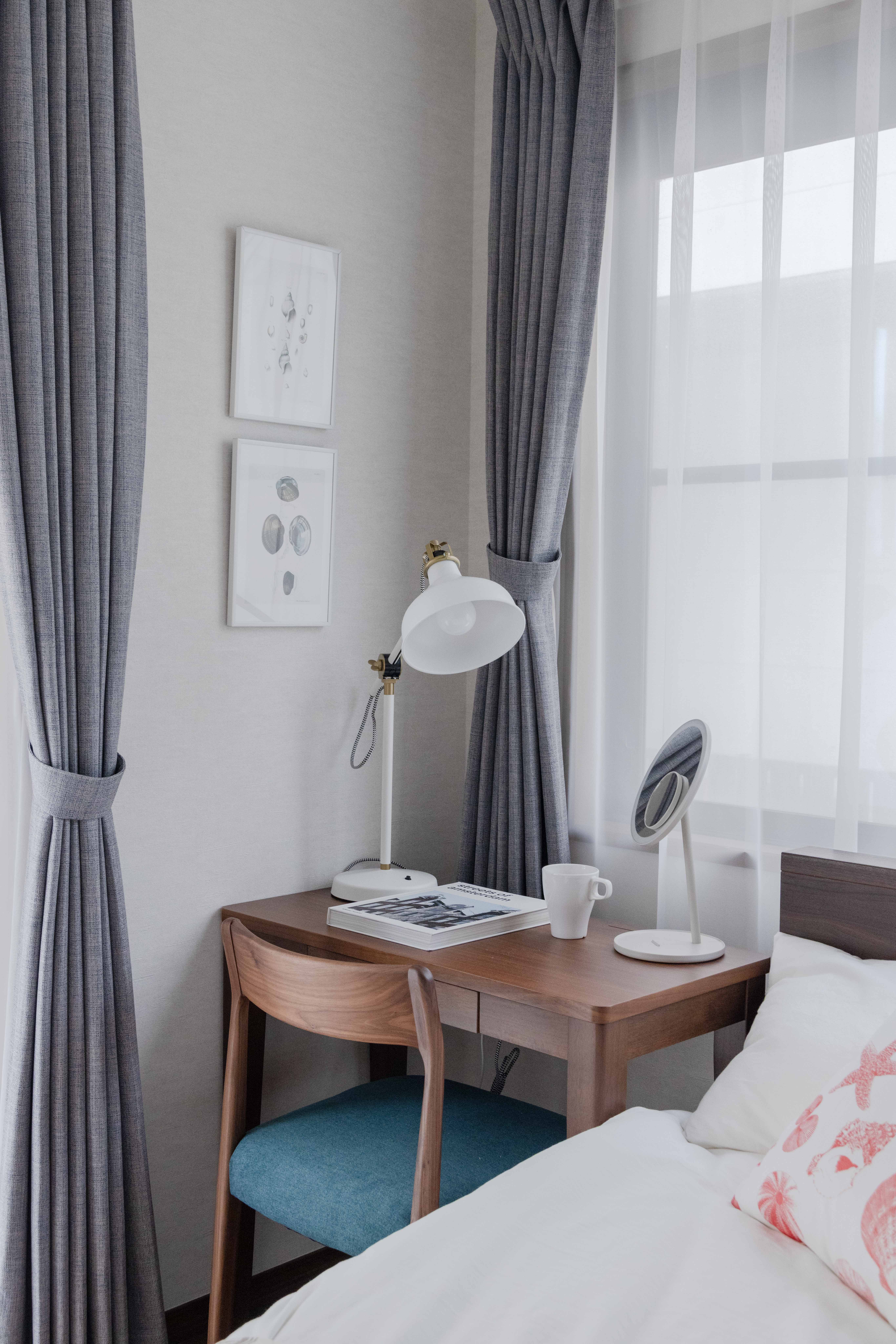 1F bedroom with desk, AC, and storage space