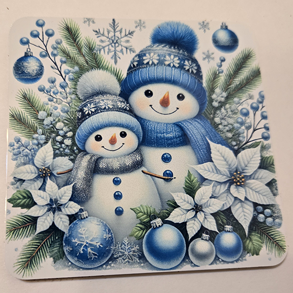 Square metal coaster with a snowmen design