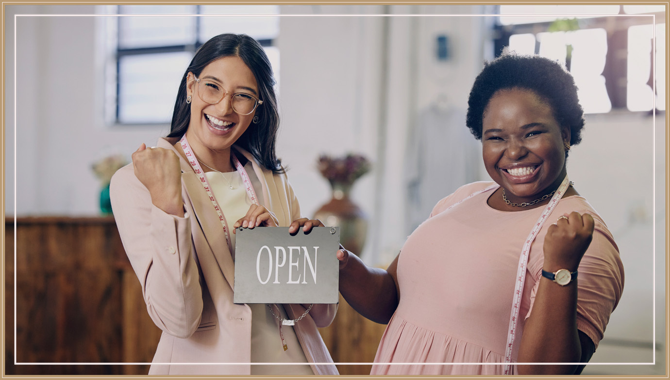Two women celebrating opening their business.