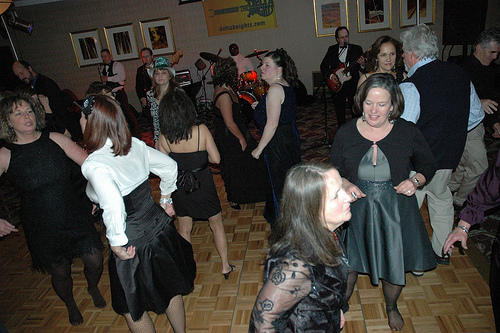 DK performing at a formal function 