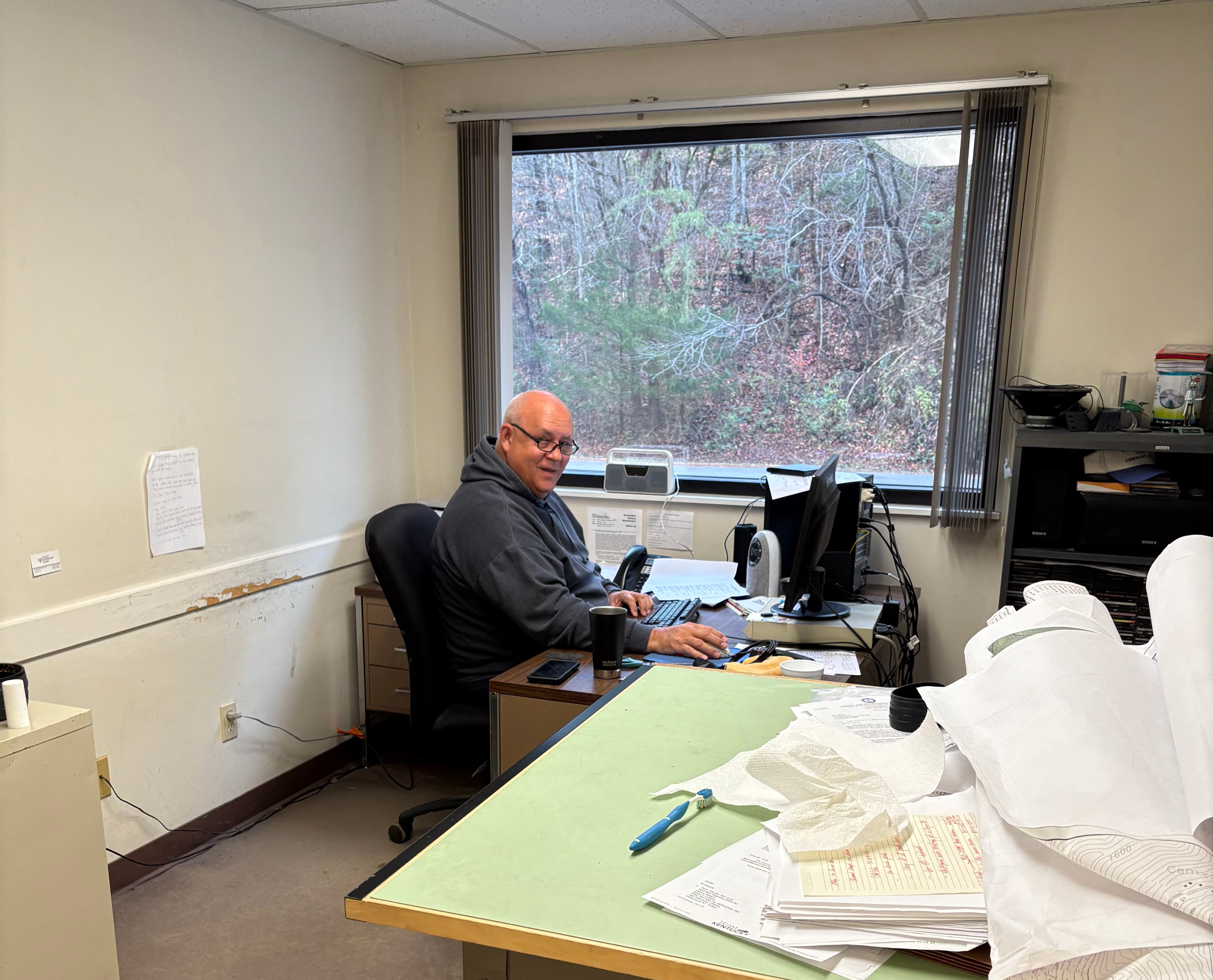 Engineering professional and land surveying professional at work in Pikeville Kentucky, creating land surveys for VA, WV, KY