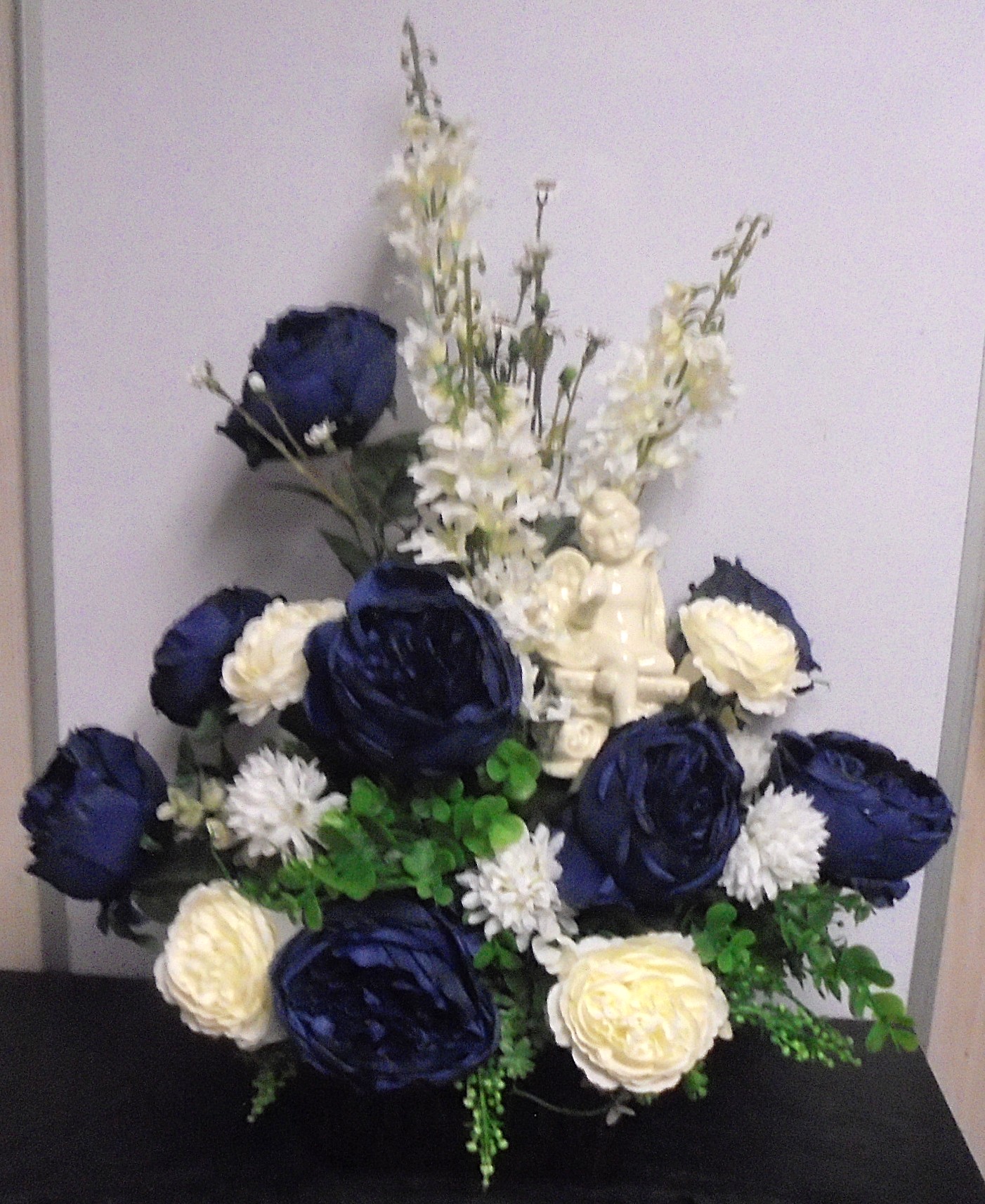 (53B) "Silk" Designer Arrangement
With Angel (Blue & White)
$70.00