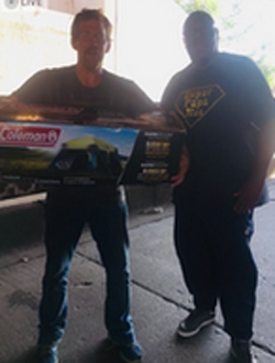 Two Men Holding Tent