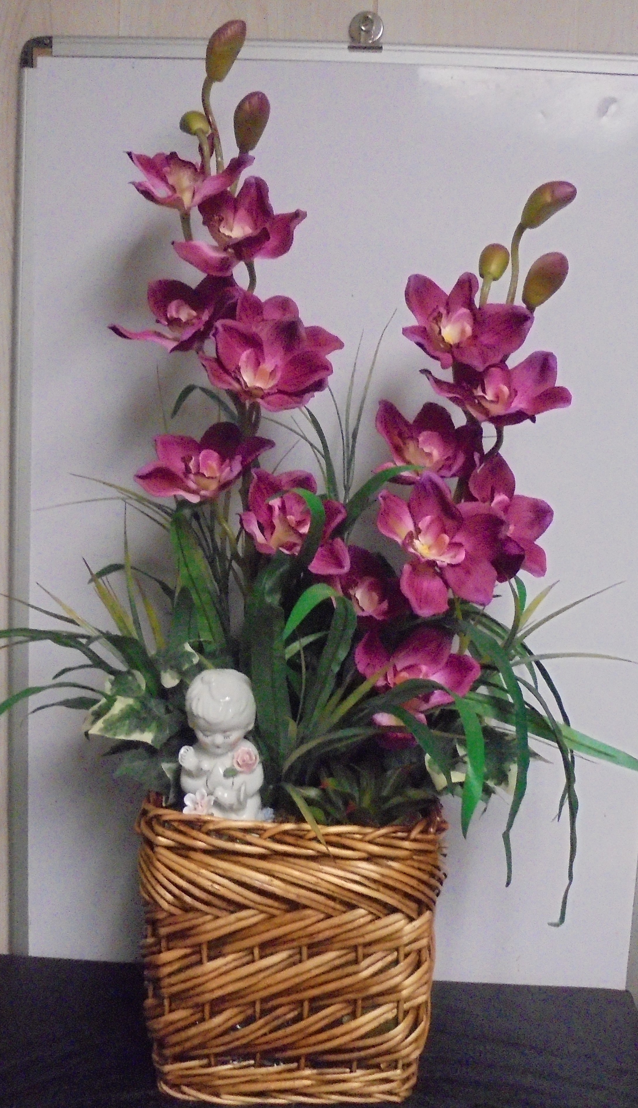 (47) "Silk" Orchid Basket
W/ Angel
$70.00