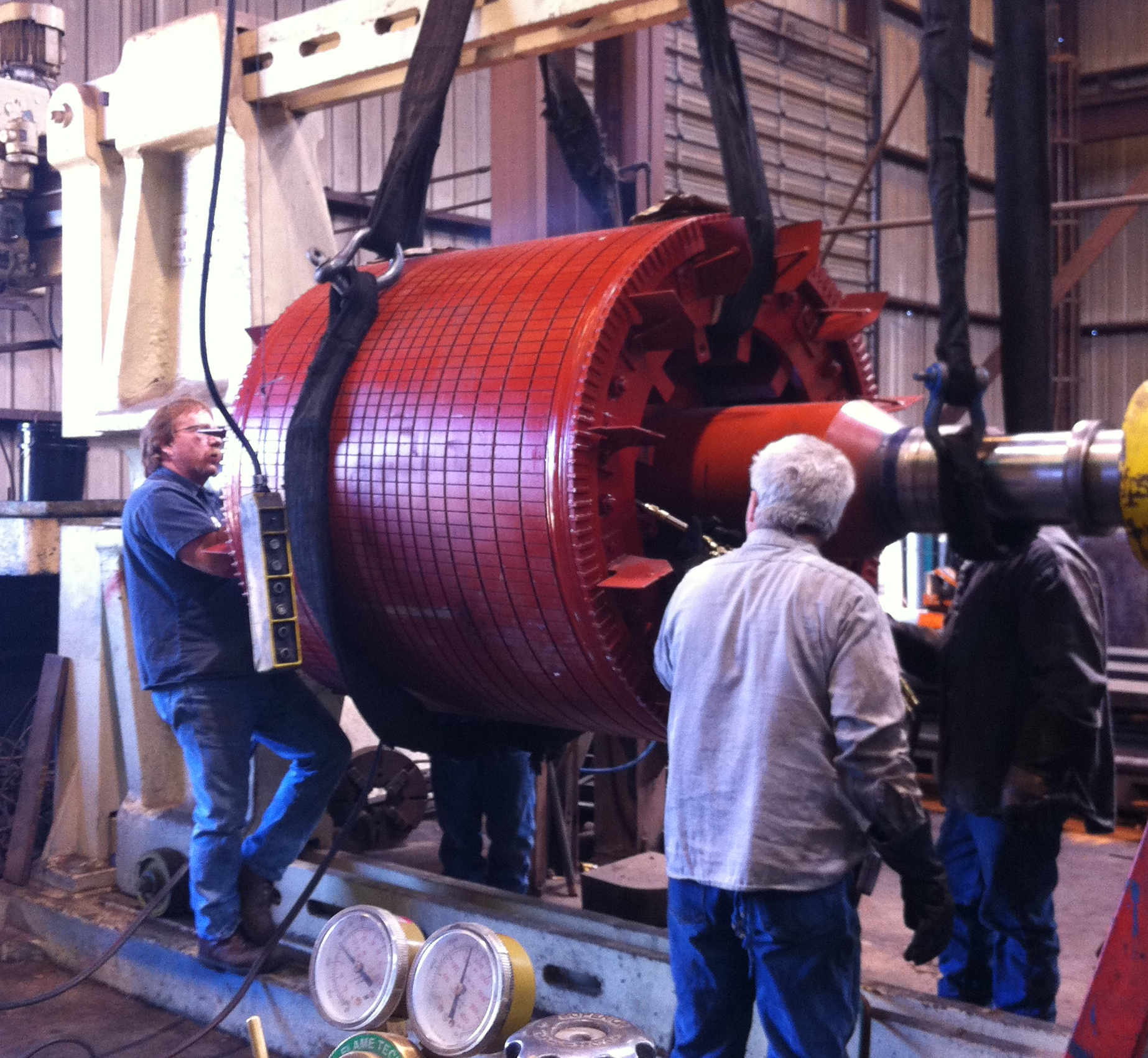 CNC machine operating in a modern manufacturing facility, emitting sparks as it cuts metal.