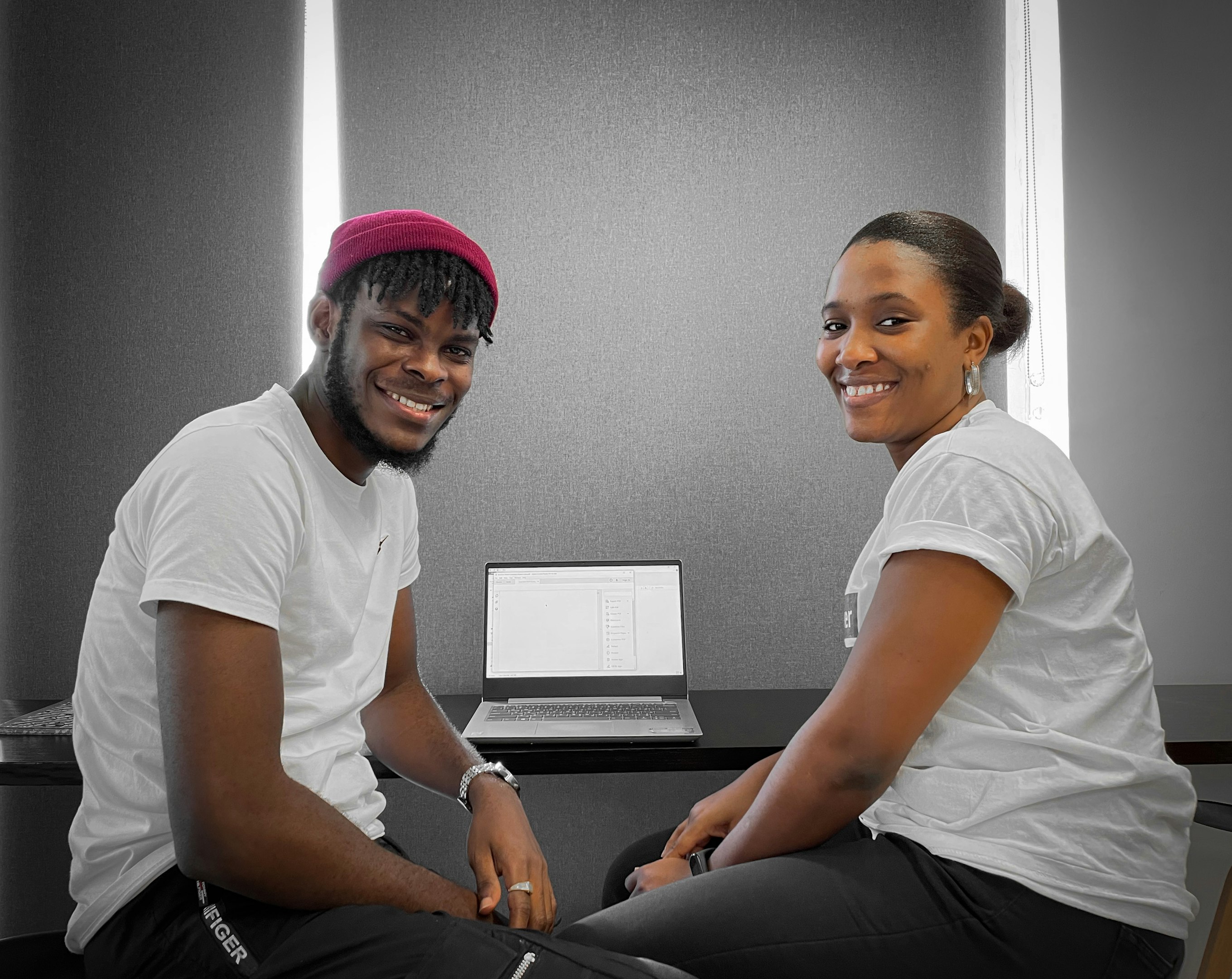 Smiling woman having a friendly consultation with a man in a bright modern office Smiling woman having a friendly consultation with a man in a bright modern office