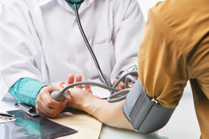 Doctor checking patient blood presure