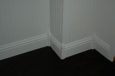 Base molding feature corner blocks with finials.
