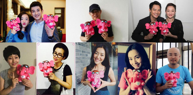 People holding an elephant coin bank