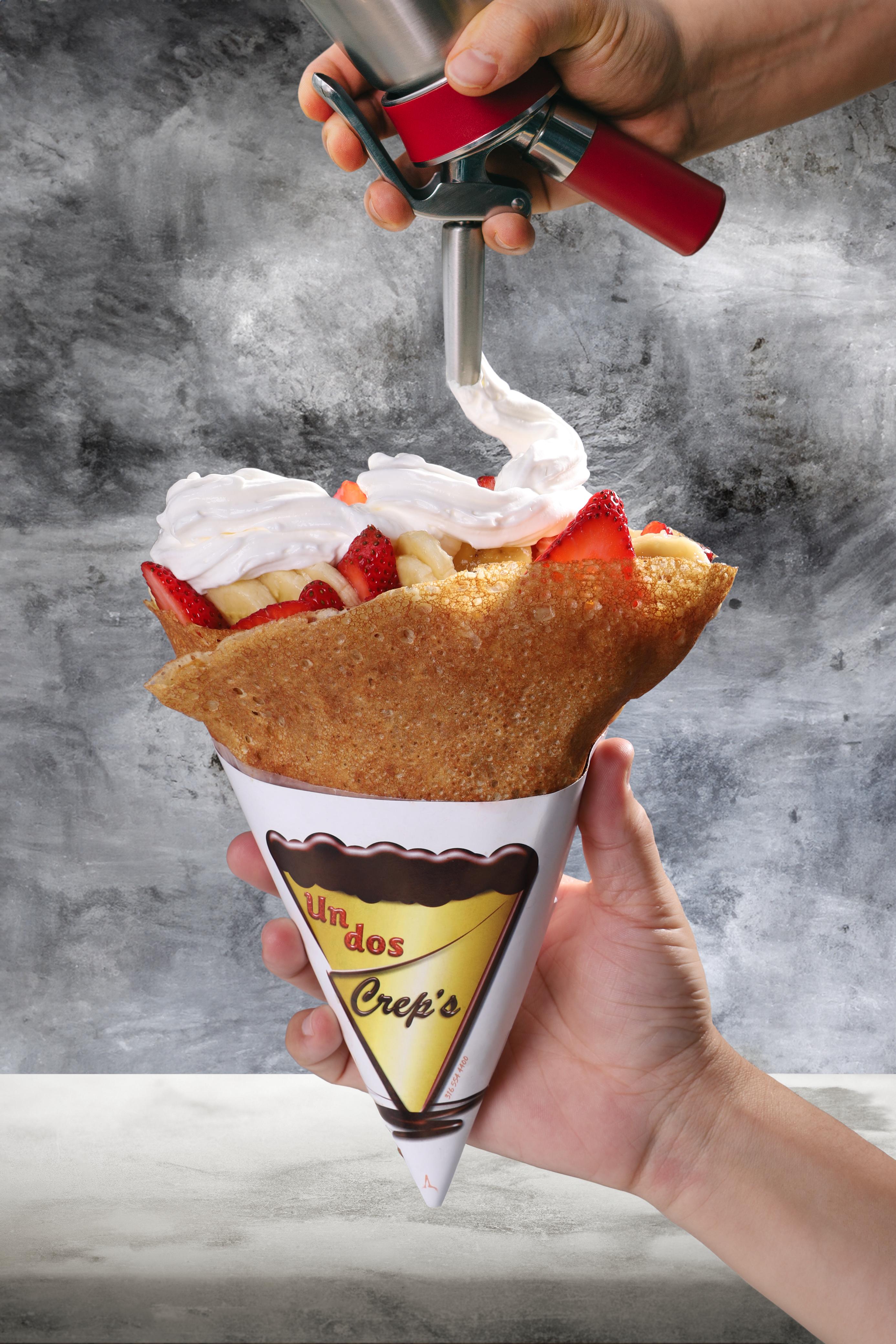 A happy couple enjoying a meal with juice, fries, and fresh vegetables in a bright, cozy kitchen with plants and natural light. A happy couple enjoying a meal with juice, fries, and fresh vegetables in a bright, cozy kitchen with plants and natural light.