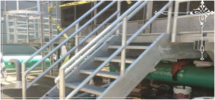 Steel stairway leading to a steel landing.