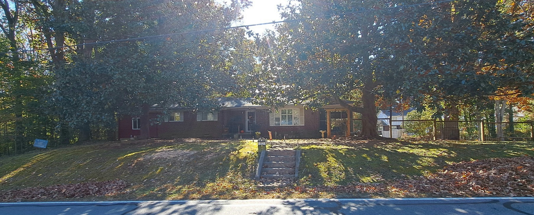 Front View of home with Magnolia trees