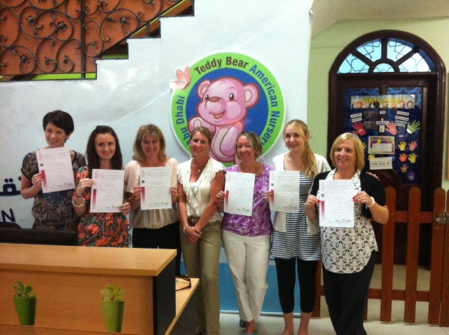 Staff at Teddy Bear Nursery receiving Cache Certificates