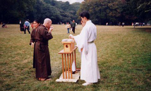 Following the exhibition, participants are served "blessed" sake that has been donated to the Meiji Shrine.