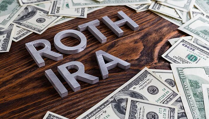 ROTH IRA Laid on Wooden Surface