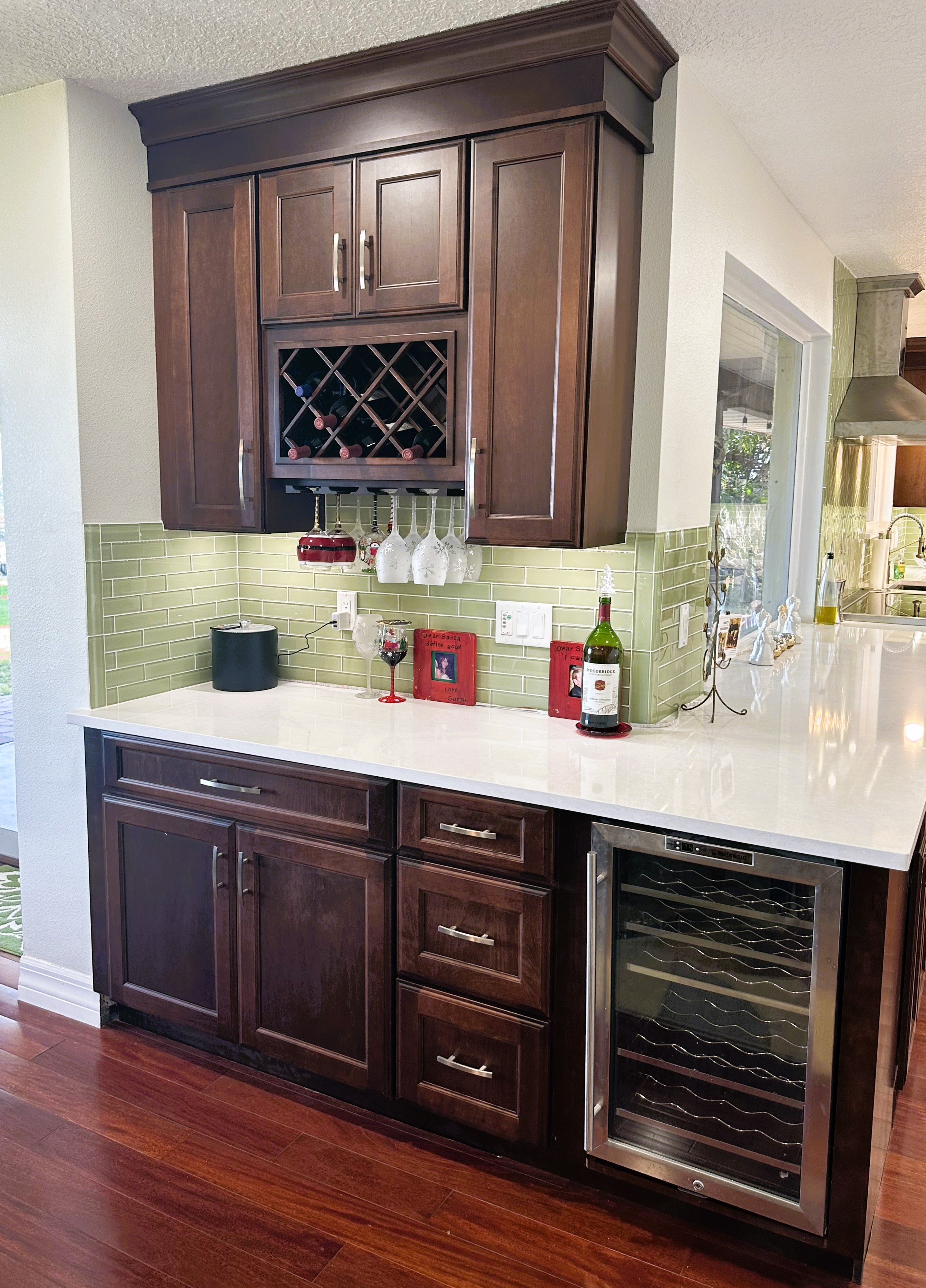 Gorgeous bar area with amenities, wine refrigerator, and extra storage.