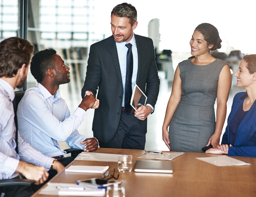 Business people smiling and talking