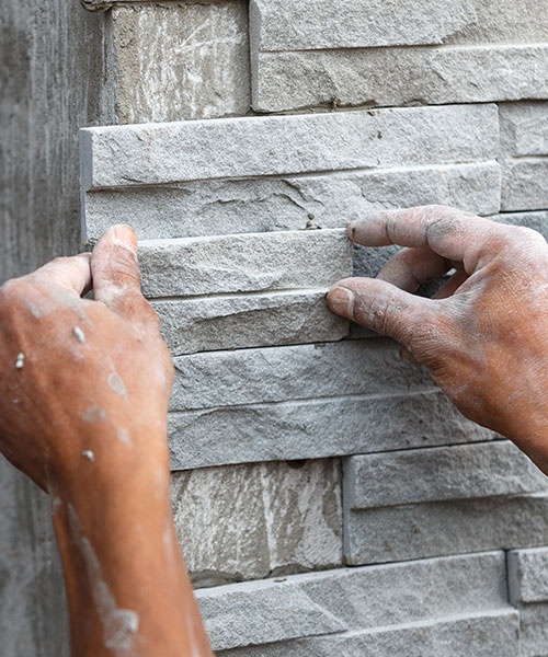 Worker Install Stone Wall Surface