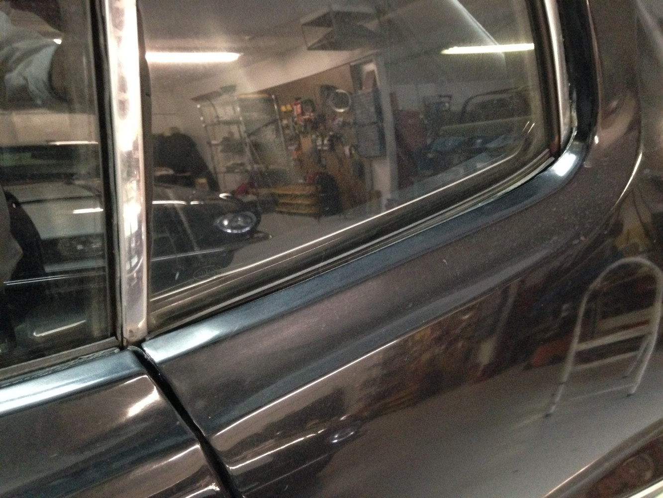 Drivers side window, Metal wavy and large gap between glass and body. Water would pour in!