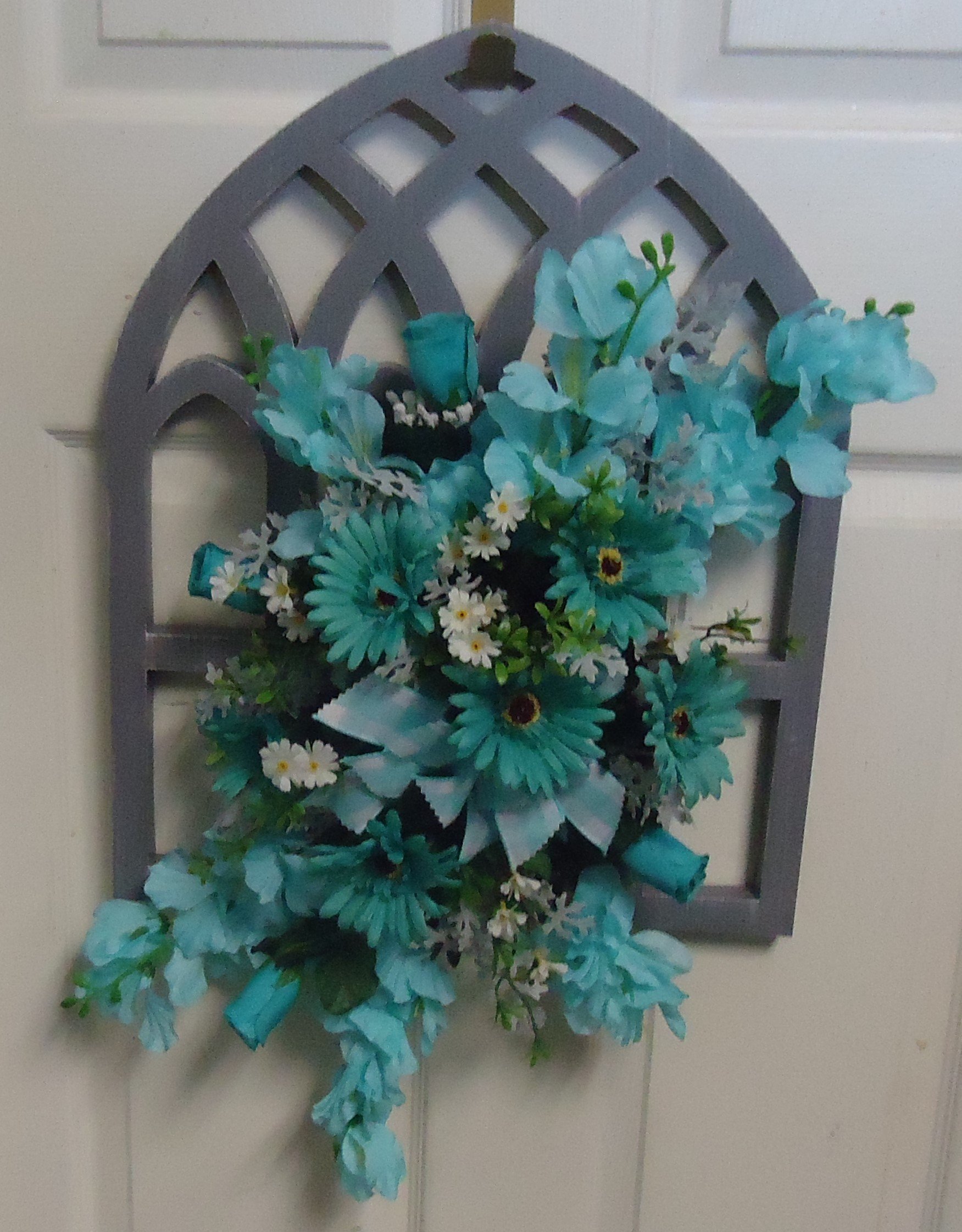 (SORRY OUT OF STOCK!!)
(11) Door Arrangement
W/ Silk Aqua Flowers
$65.00
