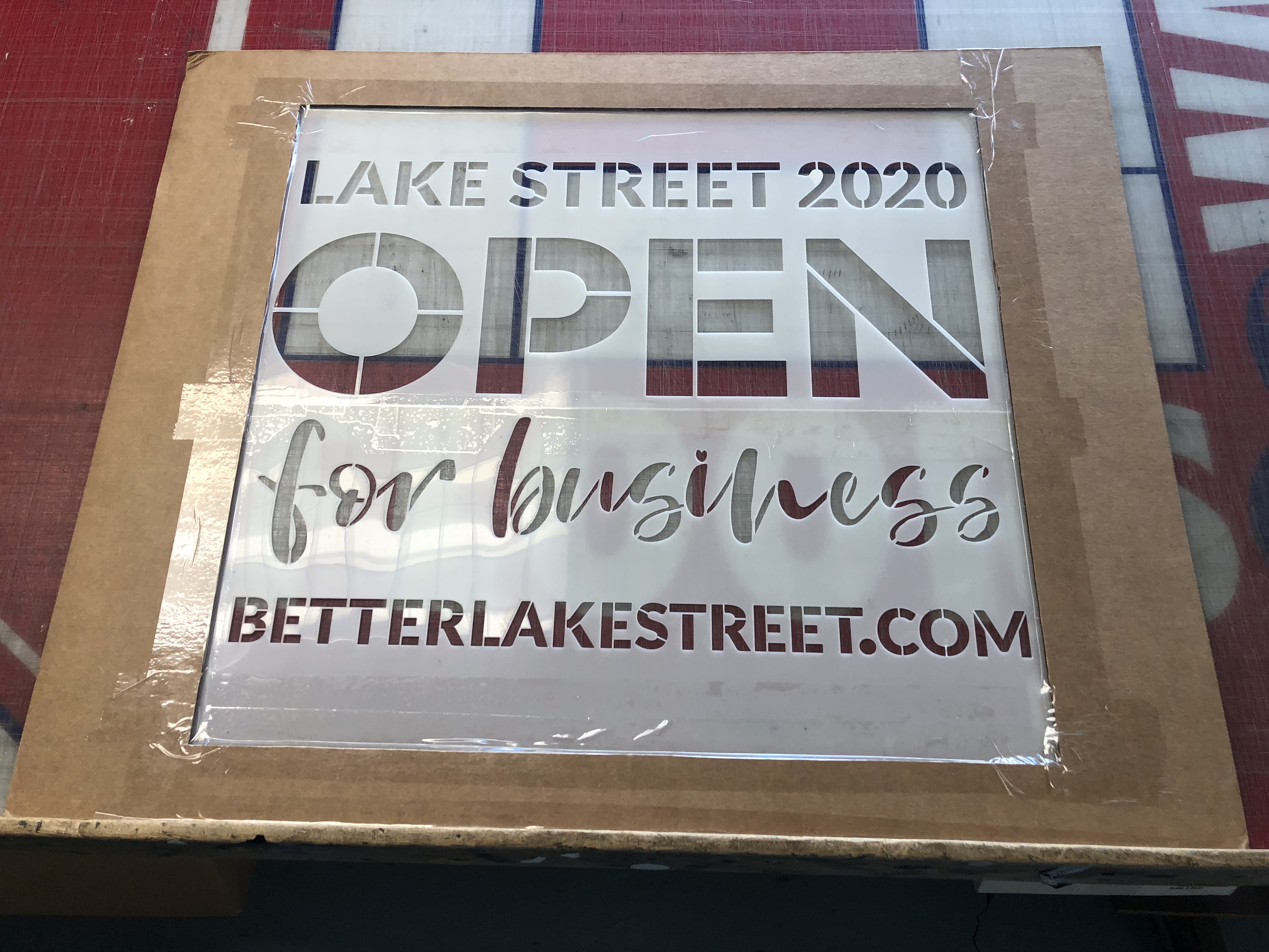 flexible plastic stencil used on sidewalks and boards