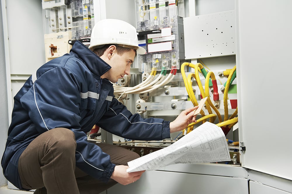 Electrician checking on commercial circuit
