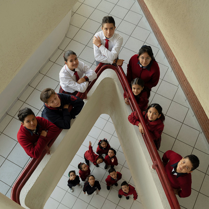 Happy kids holding notebooks