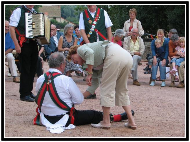 John getting a helping hand from a member of the audience
