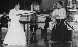 A special exhibition of Nakamura Ryu sword vs. spear techniques was shown by Nakashima Masao (r) and Okahara Shosei (l) during the International Iai-Battodo Federation All Nations Comptetition (the 6th Toyama Ryu - Nakamura Ryu Batto Competition). At the time, this was the first time in over 30 years these techniques had been displayed.
Nakashima Sensei, Hanshi 8th dan, was the senior administrator for Narita International Airport.