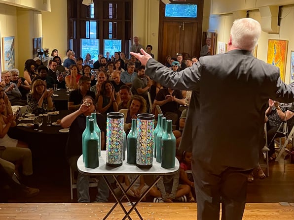 Chuck Thomas taking his bows before a corporate audience stage show. Chuck Thomas taking his bows before a corporate audience stage show.