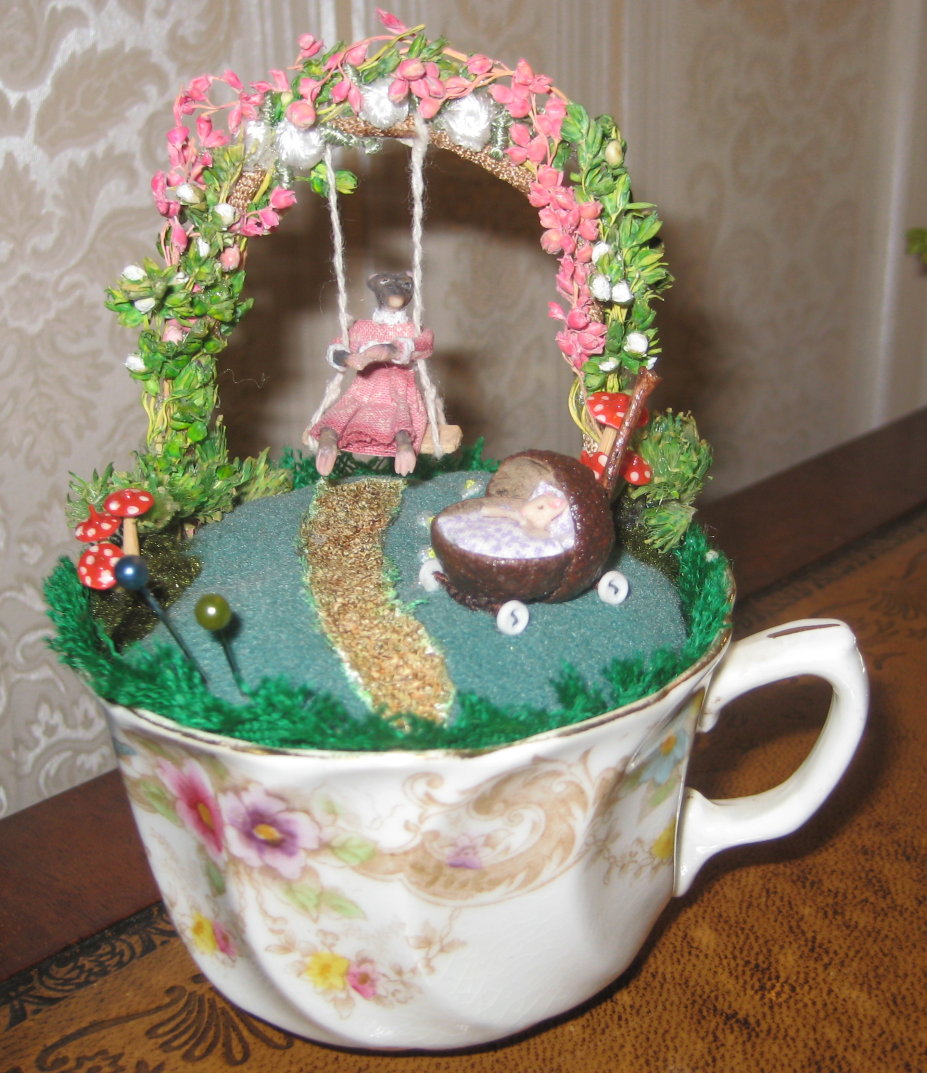 VINTAGE TEACUP PINCUSHION
SWINGING MOUSE WITH DOLL IN PRAM