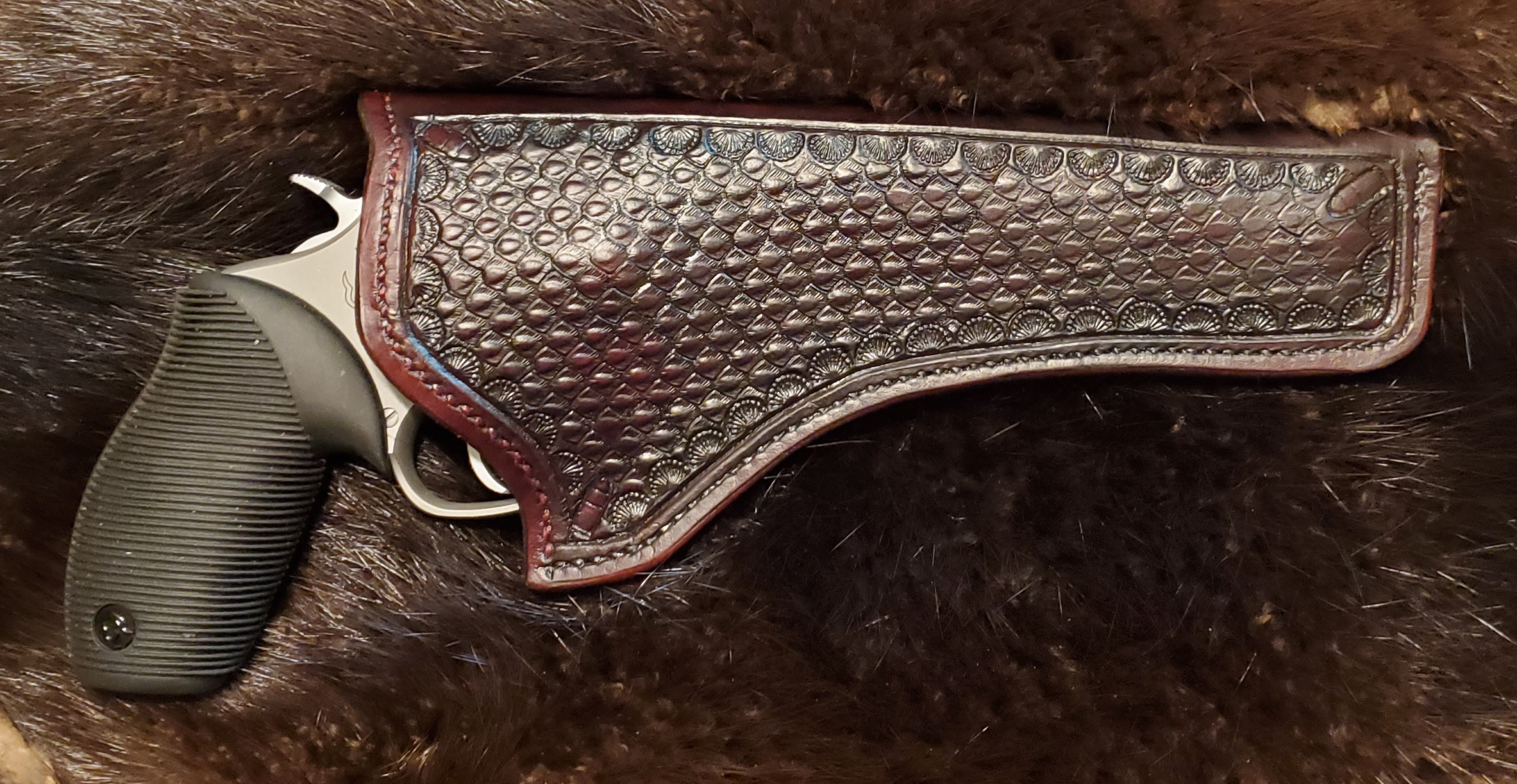 Leather Holster, hand stitched and tooled, $195.00    SOLD