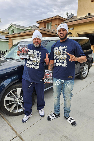 Men wearing blue Rick Ross shirts