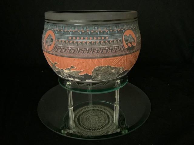 PRODUCT PROFILE :
Product No. : #21220
Description :  Noah’s Story Bowl.
PRODUCT NARRATIVE:
• Hand etched through clay slips.
•Pairs of animals walking onto 
    Noah’s ship.
• Design Coverage: inside, 
    outside & outside bottom. 
• Size: 8.5” width x 9” height.
