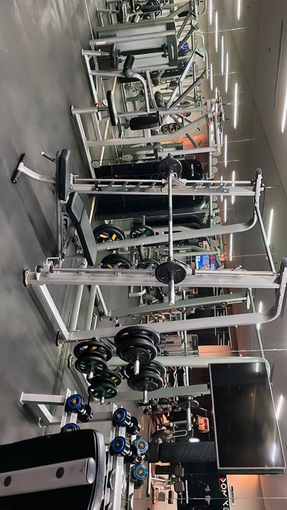 Young athletic man exercising in the rain