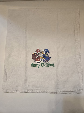 Flower sack towel featuring a Mr and Mrs Clause design