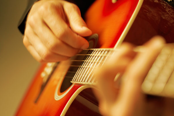 Man Playing Guitar