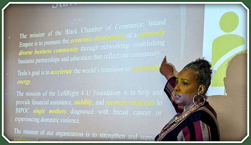 Woman giving a lecture and pointing at a screen