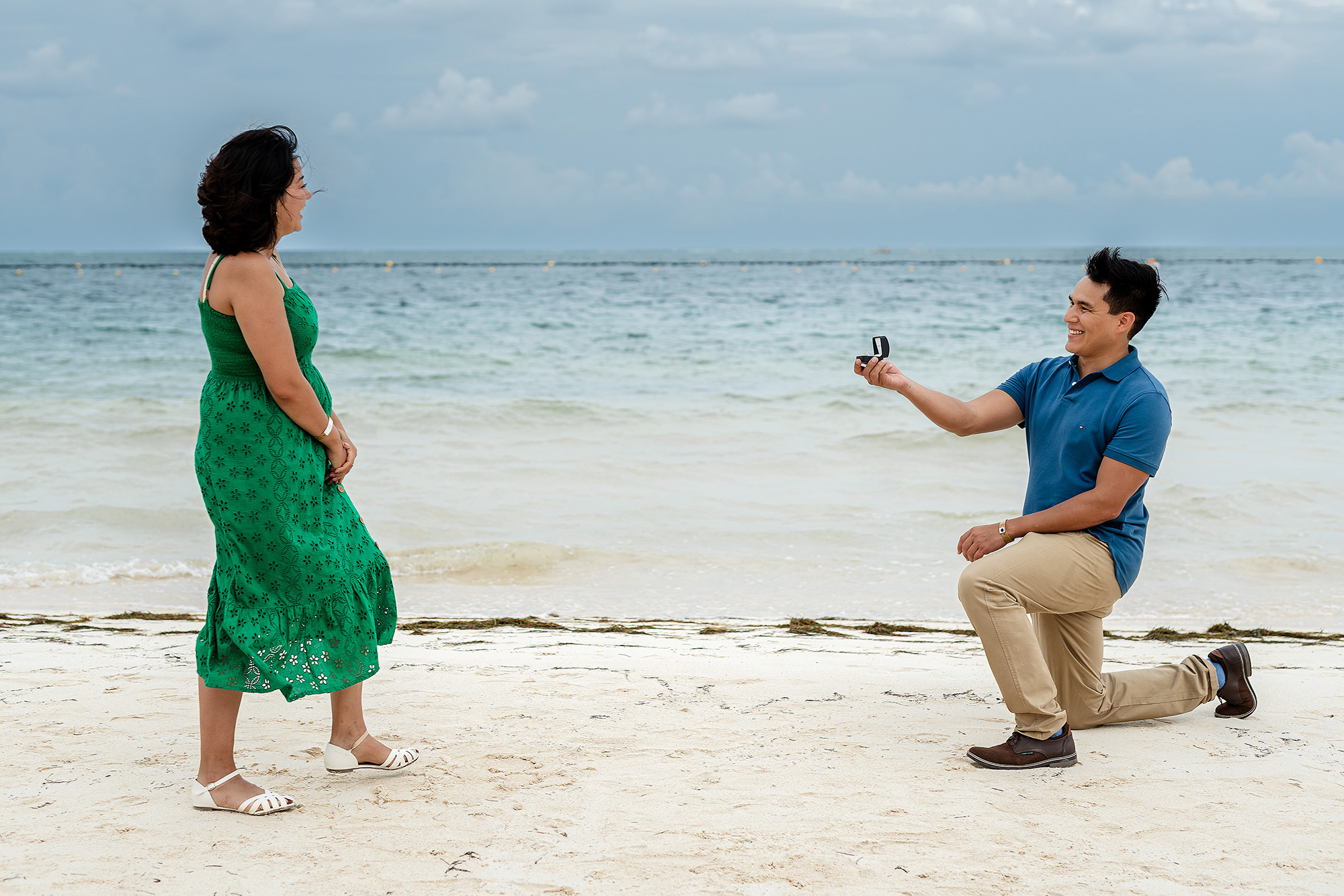 Candid engagement moment during a destination proposal session in the Riviera Maya.