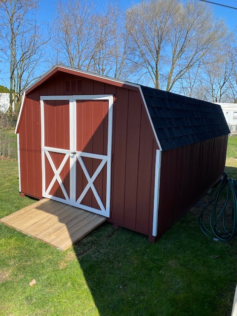 10 x 16 Economy Barn             
                                                              
Featuring colors red colored wood siding, white colored trim, black colored 30 year architectural shingles, with tar paper underlayment.

Standard Features Include:
Gable vents, rear jalousie window with a hand crank, 5' wide double doors, pressure treated floor joists, your choice of color combinations.

Featured Option:
6' Wide double doors